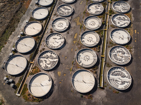 Aerial view of the decommissioned salt processing plant featuring circular sedimentation tanks and industrial infrastructure in Avalon, Victoria, Australia.