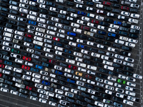 Aerial view of a large parking lot filled with numerous cars parked in neat rows at the Port Melbourne terminal in Port Melbourne, Victoria, Australia.