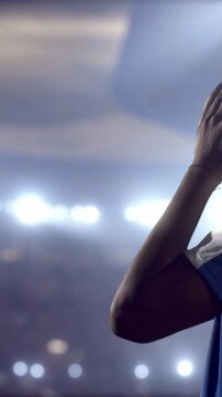 Soccer Player Reacting Emotionally with Hands on Face