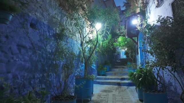 Enchanting Blue City Alleyway in Chefchaouen at Night with Glowing Lights 