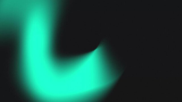 Cyan glow on black background forms smooth abstract curve. Motion blur light effect creates a fluid digital shape animation