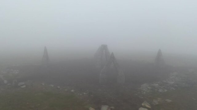 Aerial view of the stone structures of Arctic Henge shrouded in thick fog on a misty day in Raufarhofn, Nordurthing, Iceland.