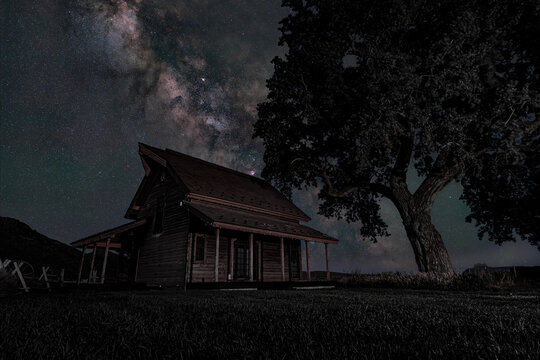 View of the Milky Way core shining above a renovated historic barn on a working ranch in Picabo, Idaho, United States.
