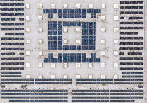 Aerial view of solar panels arranged in a geometric pattern on the roof of the ERGO ARENA in Gdansk, Wojewodztwo pomorskie, Poland.