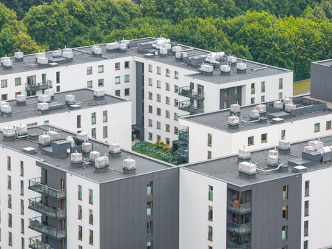 Aerial view of modern residential apartment buildings in the Oliwa district with flat roofs and balconies in Gdansk, Pomeranian Voivodeship, Poland.