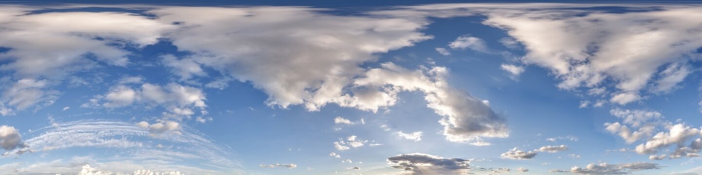 360 hdri blue sky with beautiful clouds with halo like a seamless panorama view with zenith for use in 3d graphics or game development as sky dome or edit drone shot