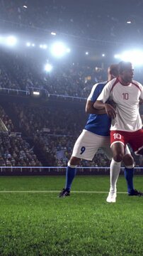 Two Soccer Players Challenging Closely for the Ball