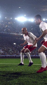 Two Soccer Teammates Running Together During a Match