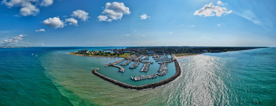 Aerial view of Kronborg Castle and the marina surrounded by the sea in Helsingor, Denmark.