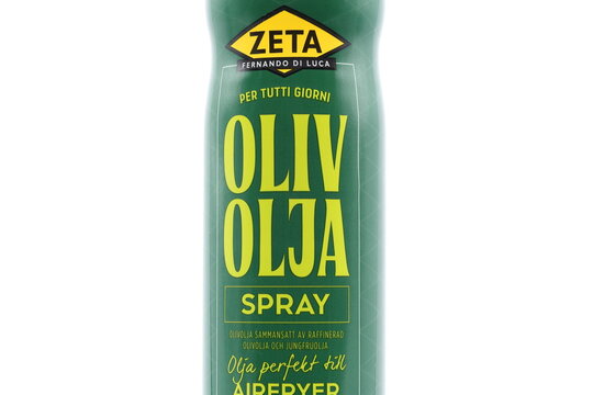 Olive oil spray. Swedish text. From Zeta. Healthy cooking oil. Close up with white background.