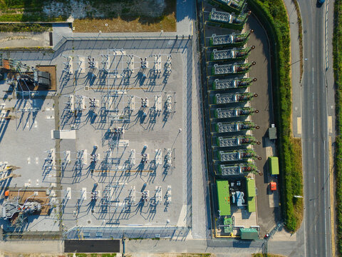 Aerial view of an electrical substation and containerized industrial generator compressor units in Immingham, England, United Kingdom.