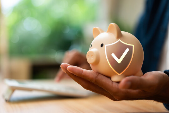 Financial Security Protection Concept with Piggy Bank Safe Savings Insurance and Wealth Protection.