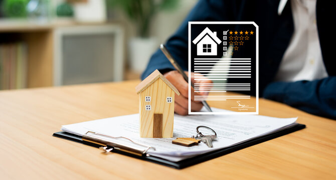 Home Inspection Property Evaluation and Real Estate Documentation with House Model Keys and Agreement Contract.