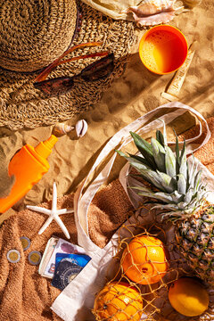 Egypt vacation concept with souvenirs and accessories. Beach sand background with copy space for text, flat lay