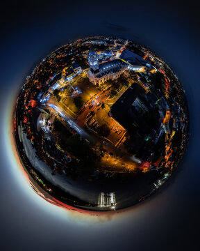 Aerial view of the illuminated cathedral and surrounding urban streets at night in San Pedro de Macoris, San Pedro de Macoris, Dominican Republic.