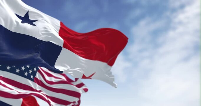 National flags of Panama and the The US waving in the wind on a clear day