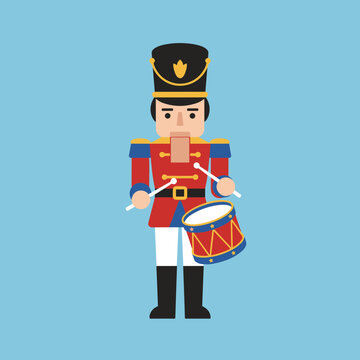 Cartoon toy soldier nutcracker playing a drum on a solid blue background