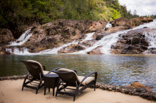 Two lounge chairs by the 5 sisters waterfalls in Eastern Belize, Central America