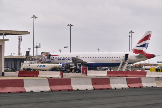 Gibraltar, Gibraltar - 01 March 2026: View of British Airways aircraft parked at the terminal of Gibraltar International Airport with ground support equipment on the tarmac.