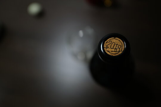 Wine Bottle Cork with Blurred Wine Glass and Bottle