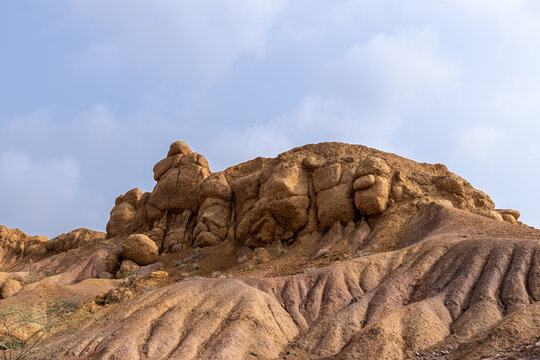 View of the unique rock formations of the Sulaiman Mountains with rugged, eroded slopes and textured terrain in De-excluded Area Dera Ghazi Khan, Punjab, Pakistan.