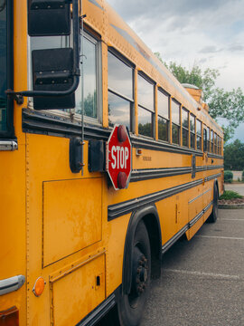 Vintage yellow school bus with stop sign on the side
