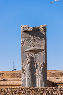 Ancient stone relief with the Faravahar symbol at Persepolis, Iran. Achaemenid royal carving preserved. UNESCO World Heritage Site