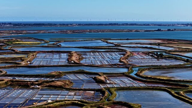 Aerial view of salt marshes with geometric patterns and water channels in Capbreton, Nouvelle-Aquitaine, France.