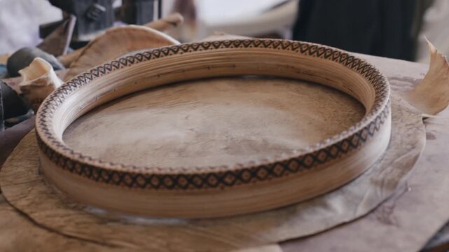 Close-up of traditional wooden frame with decorative pattern on rustic workbench