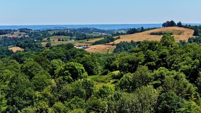 Aerial view of the lush green forests and rolling hills near the Col d'Aubisque in Beost, Nouvelle-Aquitaine, France.