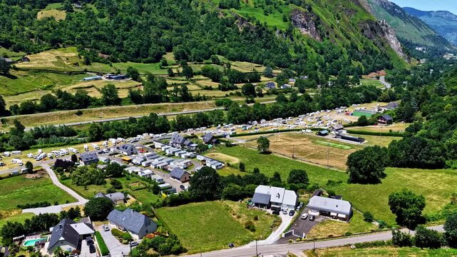 Aerial view of the campsite and surrounding green fields near the Col d'Aubisque in Beost, Nouvelle-Aquitaine, France.