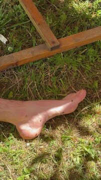Ants crawling on barefoot in grass