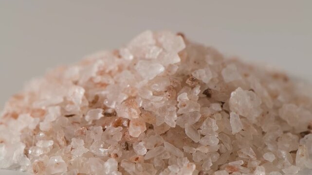 Pink rock salt crystal close up macro texture with natural mineral formation
