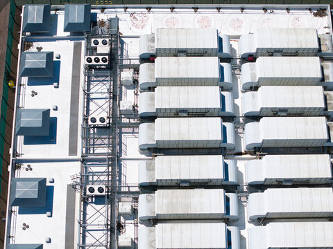 Aerial view of the ATOS data center roof featuring rows of industrial cooling units, ventilation systems, and HVAC infrastructure in Birmingham, England, United Kingdom.