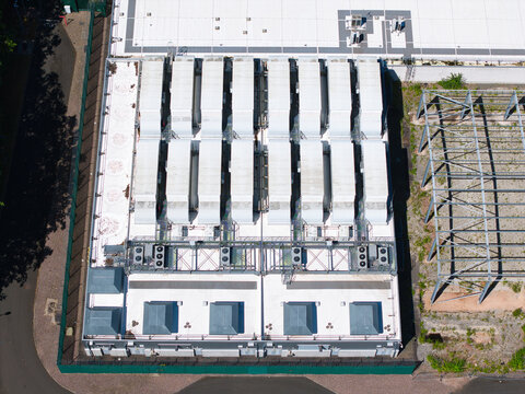 Aerial view of the ATOS data center facility featuring industrial ventilation systems and HVAC units on the roof in Birmingham, England, United Kingdom.