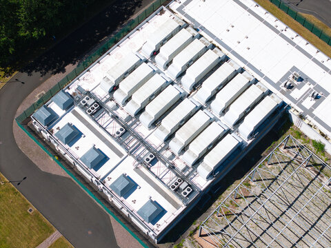 Aerial view of the ATOS data center roof featuring rows of industrial HVAC cooling units and ventilation systems in Birmingham, England, United Kingdom.