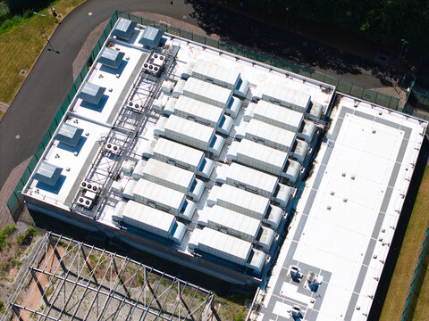 Aerial view of the ATOS data center roof featuring rows of industrial HVAC units and ventilation systems in Birmingham, England, United Kingdom.