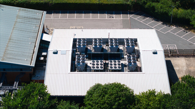 Aerial view of the Six Degrees Data Centre roof featuring industrial HVAC cooling ventilation units and AI automation infrastructure in Studley, England, United Kingdom.