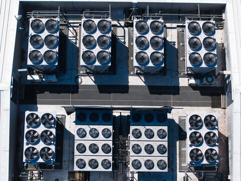 Aerial view of industrial HVAC cooling ventilation units on the rooftop of the Six Degrees Data Centre in Studley, England, United Kingdom.