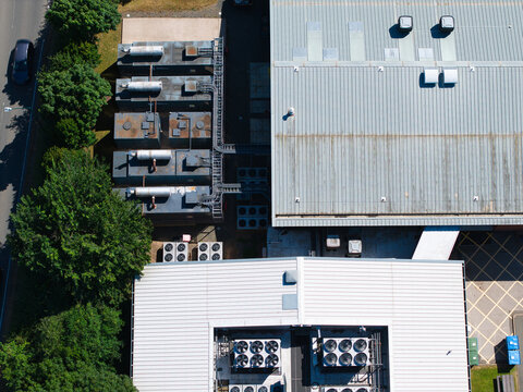 Aerial view of Six Degrees Data Centre showing industrial HVAC cooling ventilation systems and AI automation infrastructure on the roof in Studley, England, United Kingdom.