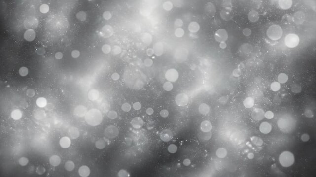 Abstract gray bokeh background with light particles and soft glowing circles