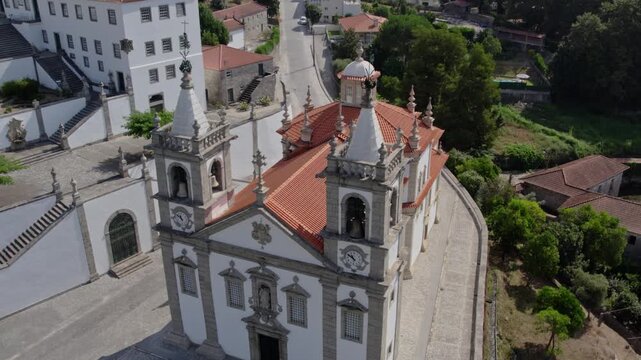 Aerial view of the Santuario de Nossa Senhora de Porto de Ave with its twin bell towers and terracotta roof in Taide, Braga, Portugal.