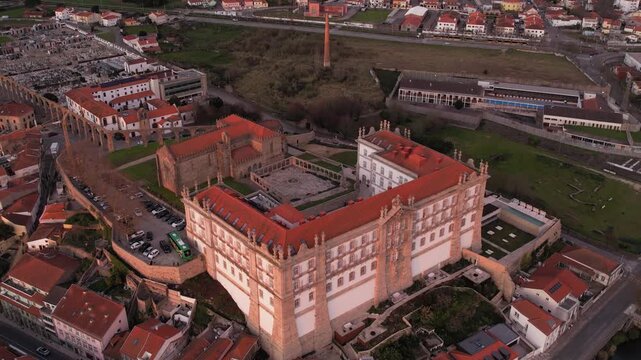 Aerial view of the historic Igreja e Mosteiro de Santa Clara with its red-tiled roofs and surrounding urban landscape in Vila do Conde, Porto, Portugal.