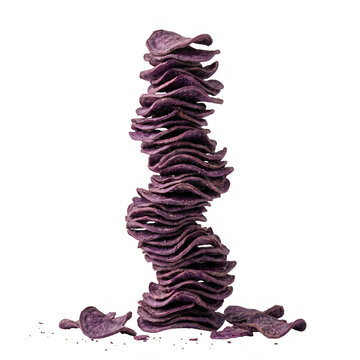 A tall stack of crunchy purple corn tortilla chips isolated on transparent background