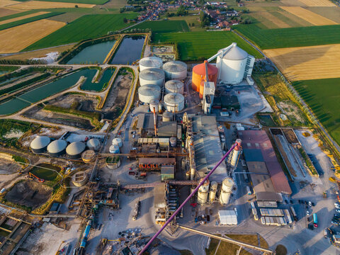 Aerial view of the sugar factory with industrial silos, processing buildings, and surrounding agricultural fields in Antoing, Region wallonne, Belgium.