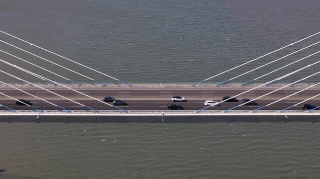 Aerial view of the Vasco da Gama Bridge with traffic flowing over the Tagus River in Lisboa, Portugal.