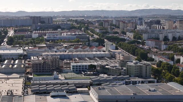 Aerial view of the Braco de Prata district featuring industrial architecture, residential buildings, and urban infrastructure in Lisboa, Lisboa, Portugal.