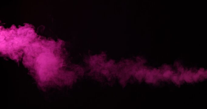 Beautiful smoke in neon light on dark background