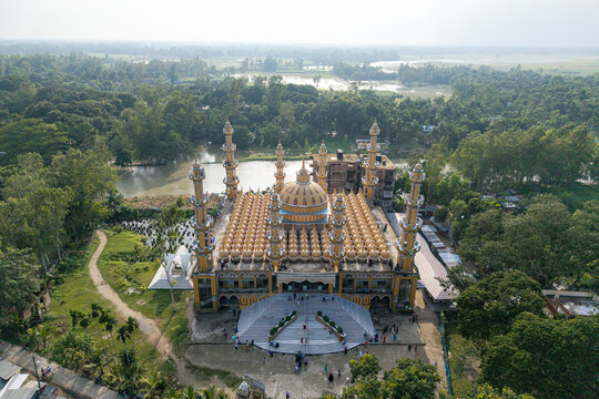 Tangail District, Bangladesh - 17 July 2026: Aerial view of 201 Gombuj Masjid, featuring its distinctive multiple domes and minarets set amidst a lush green landscape.