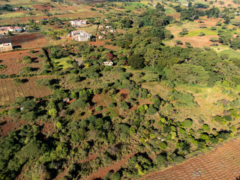 Aerial view of the rural landscape of Kimana featuring scattered acacia trees, small agricultural plots, and sparse vegetation in Kimana, Kajiado County, Kenya.